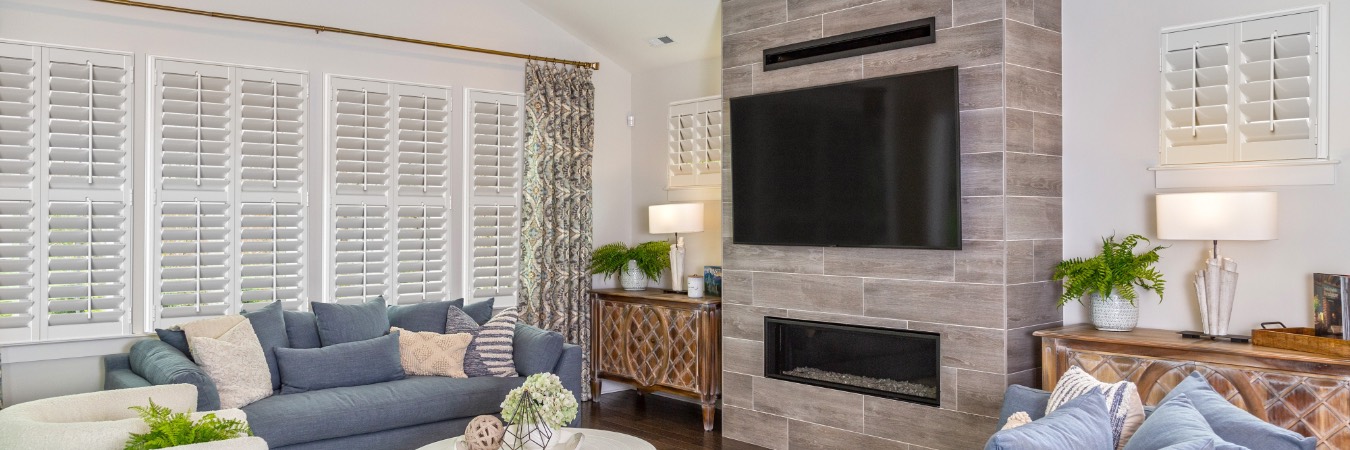 Interior shutters in Centreville family room with fireplace